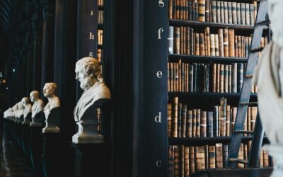 Open law books on a wooden table representing judicial-services revision