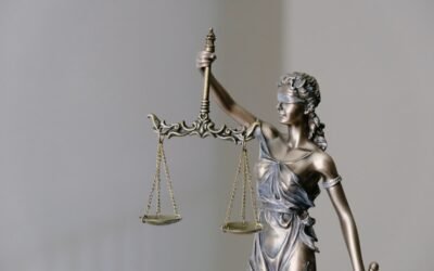Scales of justice on a law book representing Rajasthan Judicial Service Civil Judge exam preparation