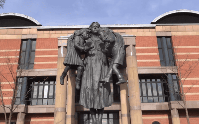 Scales of justice statue against the sky
